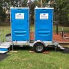 Two portable toilets on a trailer available for hire for events in Sydney